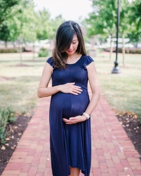 pregnant mom holding baby bump